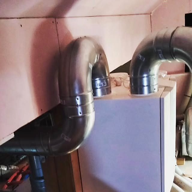 A heat recovery unit in a loft, with semi-rigid tubing run down inside the walls. A unit like this is serviced from the hatch in a couple of hours.