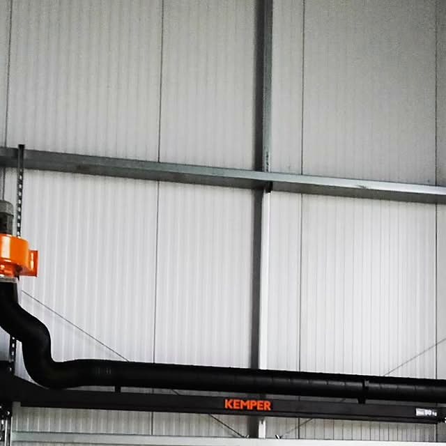 Four vehicle exhaust extract systems: the hose clips straight onto the tailpipe and takes the fumes out of the building rather than around it.